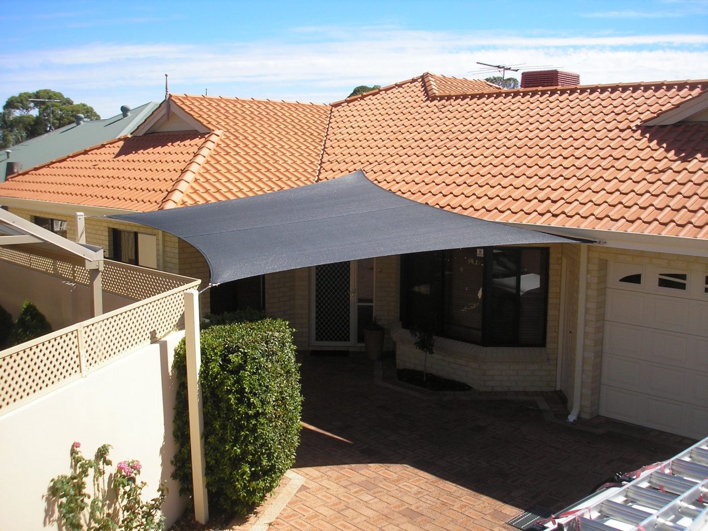 Charcoal shade sail over a South Perth backyard